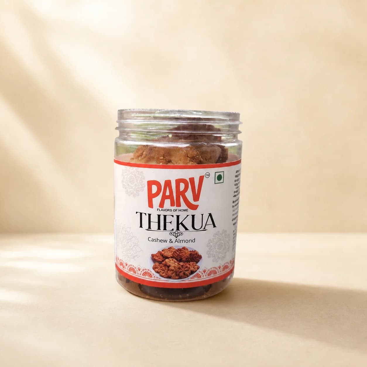 PARV FOODS Traditional Thekua jar shown from the front on a warm cream background